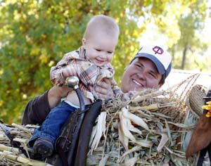 lil guy and dad on cornstalk horse low