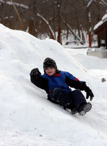 boy sliding down hill