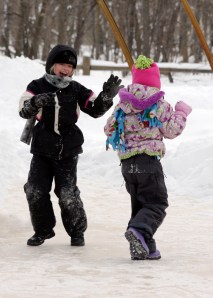 girls playig in snow
